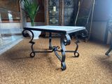 a table that has a marble top on top of it