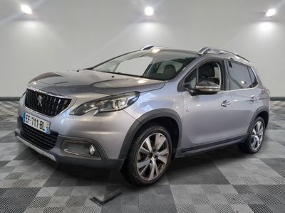 a silver car parked in a room with a checkered floor