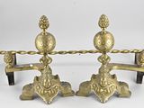 pair of antique brass candlesticks on a stand