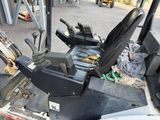 an image of a forklift sitting in a garage
