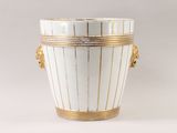 a white and gold vase with handles on a white background