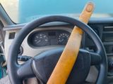 a steering wheel with a wooden stick in it