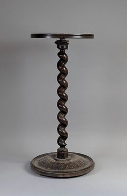 a small table with a wooden base and a metal base