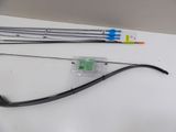 a bow and arrow sitting on a table next to a toothbrush