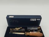 two pens in a blue box on a white surface