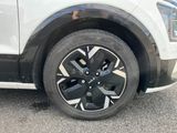 a close up of a tire on a white car