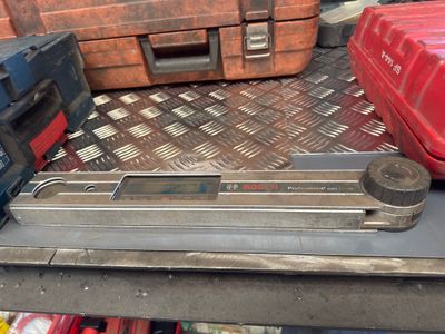 some tools are sitting on top of a table in a room