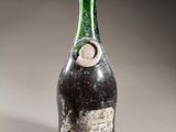 a bottle of wine that is sitting on a table