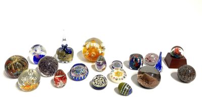 a lot of different colored glass beads on a white surface