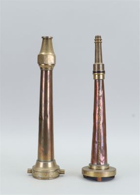 pair of antique brass candlesticks on a white background