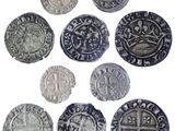 six types différents de pièces d'argent sur fond blanc