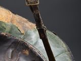 a close up of a helmet with a stick sticking out of it