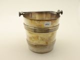 an antique silver plated ice bucket with handles on a white background