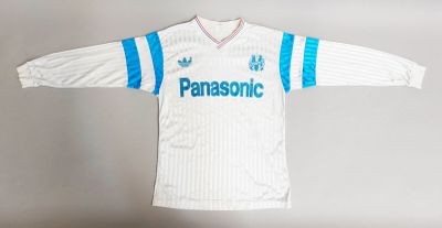 a white shirt with a blue and white stripe on it