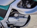a close up view of a motorcycle parked on the street