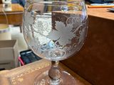 a glass of water sitting on top of a wooden table