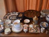 a table with a lot of china and other items on it