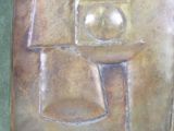 a metal plaque with a picture of a man on it