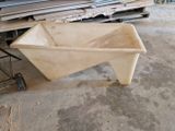 a wheelbarrow and a cart in a warehouse