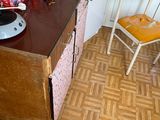 a small kitchen with a table and a chair in it