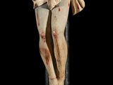 an old wooden crucifix with a cross on a black background