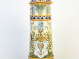 a tall vase with a blue and white design on it