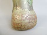 a vase that is sitting on a white surface