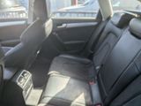 a picture of the inside of a car with black leather seats