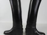 pair of black leather riding boots on a white background