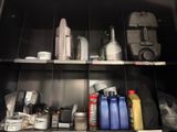 a metal cabinet with many different types of items on it