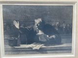 an old picture of a man sitting on a table with a book