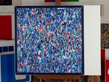 a picture of a painting on a easel in a room