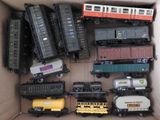 a lot of toy trains in a box on the table