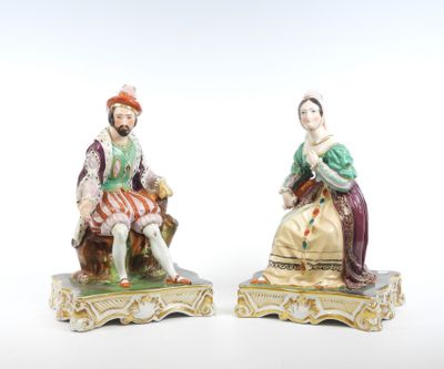 paire de figurines en porcelaine représentant un homme et une femme assis sur un banc