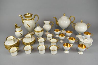 a lot of white and gold items on the table