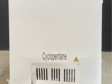 an image of a white refrigerator sitting on top of a wooden pallet