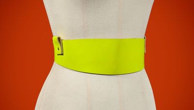 a close up of a mannequin torso with a yellow belt