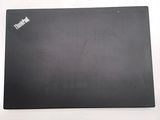 a black laptop with a sticker on it