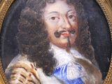 painting of a man with a mustache in a gold frame