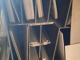a lot of folders stacked on a shelf in a room