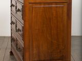 an image of a wooden chest of drawers on a hard wood floor