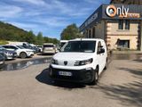 a white van that is parked in front of a building