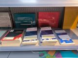 many books on the shelf in the library