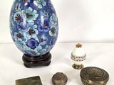 a blue and white vase and other items on a table