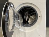 an image of a washing machine with a door open