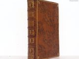a brown book that is sitting on a table