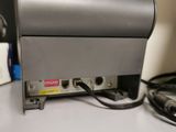 a silver machine sitting on top of a white table