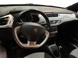 the interior of a car with a steering wheel, dashboard and dashboard controls