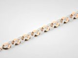 un bracelet en or et en argent muni d'un fermoir en diamant