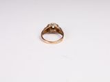 an image of a gold ring with a diamond